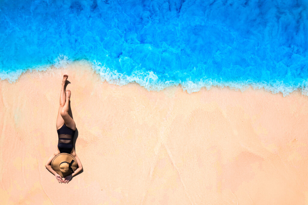 Lady laying on a beach